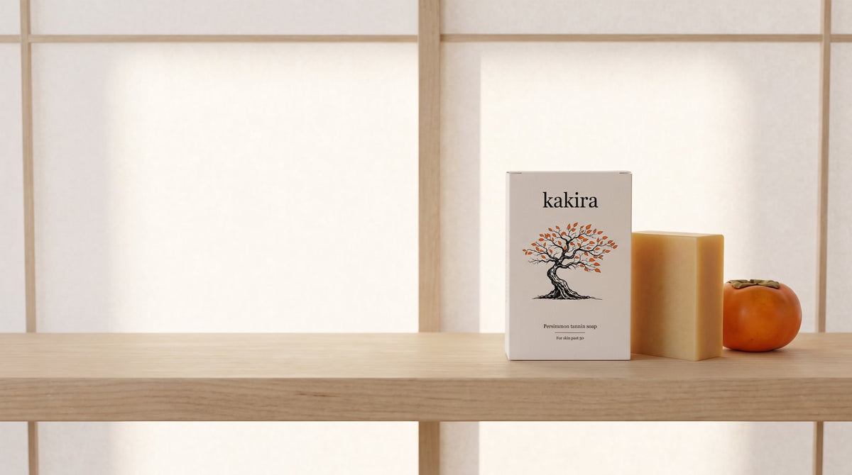 kakira box, bar and a persimmon on a wooden shelf
