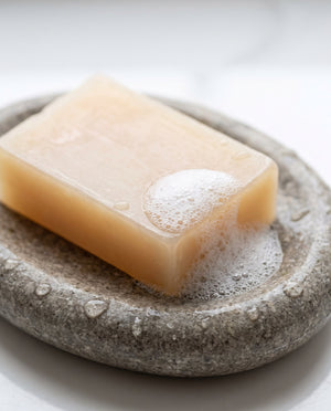 The bar with lather on a stone dish